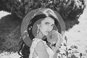 Barber shop. Hair style. Bride with long brunette hair with flower.