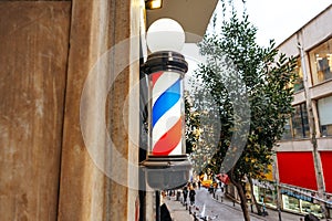 Barber shop light round tricolor pole spiral sign on the building