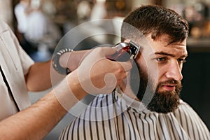 Barber Shop Men Hair Cut. Barber Doing Men Fashion Hairstyle