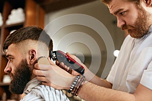 Barber Shop Men Hair Cut. Barber Doing Men Fashion Hairstyle