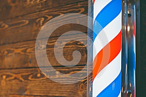 Barber shop pole. Logo of the barbershop, symbol. Barbershop pole, retro. Copy space