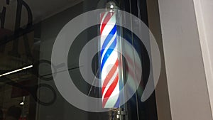 Barber shop pole sign outside