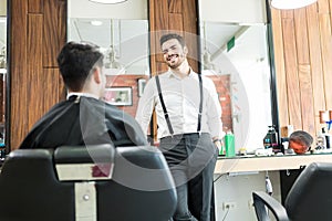 Barber Talking To Customer While Asking About His Preferences photo