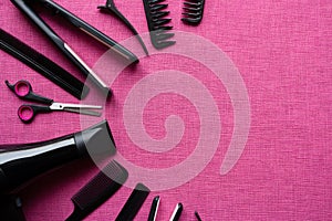 Barber tools on a pink background and space for text