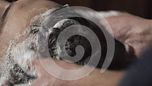 Barber washing man head in barbershop