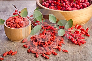 Barberry and dry goji berries in bowls