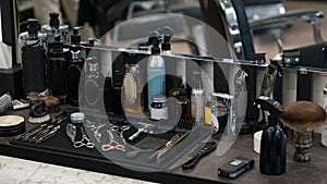 Barbers tools for mens haircuts laid out on a table. Men's hair and beard care products.