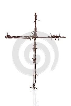 Barbwire cross isolated over white.