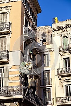 Barcelona. Chinese dragon on House of Umbrellas (Casa Bruno Cuadros) building on La Rambla photo