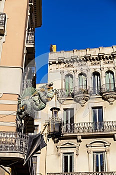 Barcelona. Chinese dragon on House of Umbrellas (Casa Bruno Cuadros) building on La Rambla photo