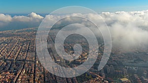 Barcelona City above the clouds and fog, Eixample residential famous urban grid