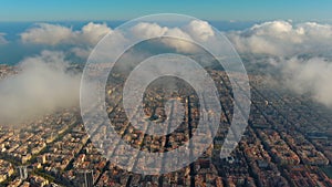 Barcelona City above the clouds and fog, Eixample residential famous urban grid