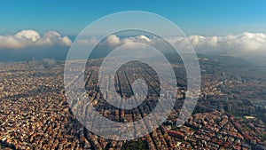 Barcelona City above the clouds and fog, Eixample residential famous urban grid