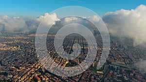 Barcelona City above the clouds and fog, Eixample residential famous urban grid