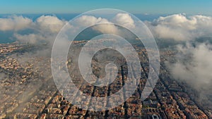 Barcelona City above the clouds and fog, Eixample residential famous urban grid