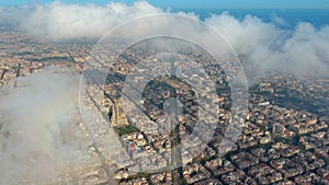 Barcelona City above the clouds and fog, Eixample residential famous urban grid