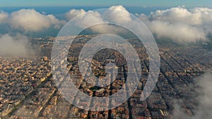 Barcelona City above the clouds and fog, Eixample residential famous urban grid