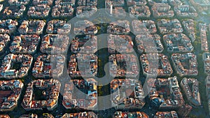 Barcelona city skyline, aerial view. Eixample residential district at sunrise