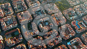 Barcelona city skyline, aerial view. Eixample residential district at sunrise