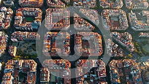 Barcelona city skyline, aerial view. Eixample residential district at sunrise