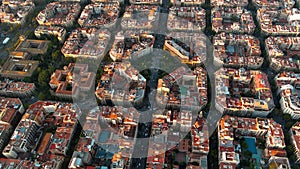 Barcelona city skyline, aerial view. Eixample residential district at sunrise