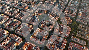 Barcelona city skyline, aerial view. Eixample residential district at sunrise