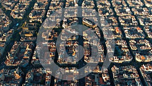 Barcelona city skyline, aerial view. Eixample residential district at sunrise