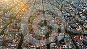 Barcelona city skyline, aerial view. Eixample residential district at sunrise