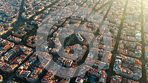 Barcelona city skyline, aerial view. Eixample residential district at sunset