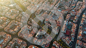 Barcelona city skyline, aerial view. Eixample residential district at sunset