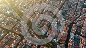 Barcelona city skyline, aerial view. Eixample residential district at sunset