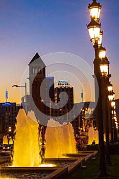 Barcelona fountains at twilight with Torres Venecianes and lanterns Spain