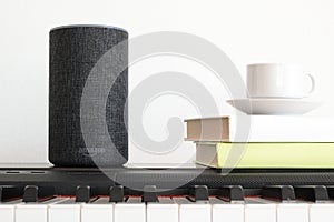 BARCELONA - JUNE 2018: Amazon Echo Smart Home Alexa Voice Service on a piano in a living room on June 20, 2018 in Barcelona.