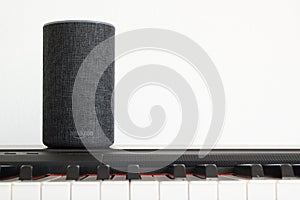 BARCELONA - JUNE 2018: Amazon Echo Smart Home Alexa Voice Service on a piano in a living room on June 20, 2018 in Barcelona.