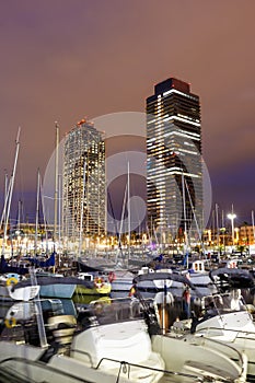 Barcelona Marina yacht harbor Port Olimpic city town at twilight portrait format in Spain photo