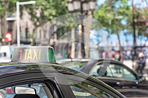 BARCELONA - MAY 11, 2018: Taxis along city roads. Barcelona attracts 10 million tourists annually