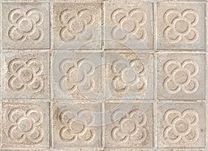 Barcelona pavement tiles with a flower, panot slabs with symbol texture top view photo