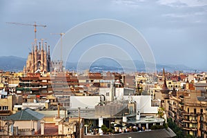 Barcelona roofs against background of Sagrada Familia