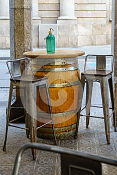Barcelona, Spain - April 18, 2022. Table in a typical Spanish restaurant prepared for aperitif, vermouth with bottle of soda