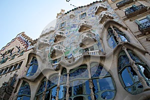 BARCELONA, SPAIN - AUG 30th, 2017: The curving shaped stone facade of Gaudi`s Casa Batllo, outdoor view on a sunny day