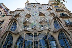 BARCELONA, SPAIN - AUG 30th, 2017: The curving shaped stone facade of Gaudi`s Casa Batllo, outdoor view on a sunny day