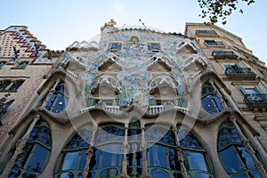 BARCELONA, SPAIN - AUG 30th, 2017: The curving shaped stone facade of Gaudi`s Casa Batllo, outdoor view on a sunny day