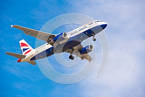 BARCELONA, SPAIN - AUGUST 20, 2016: British Airways plane in the blue sky. Copy space for text.