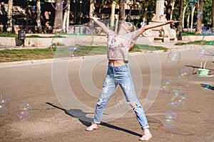 Barcelona, Spain, girl playing and having fun with a soap bubble