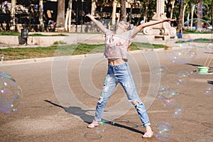 Barcelona, Spain, girl playing and having fun with a soap bubble