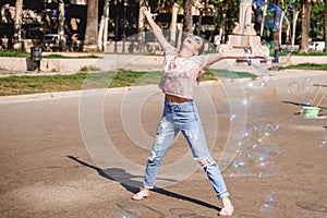 Barcelona, Spain, girl playing and having fun with a soap bubble