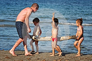 Barcelona, Spain, June 23 2013 - The Mediterranean coast, playing with the kids