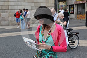 BARCELONA SPAIN - JUNE 9:: Tourist looks in a map June 9, 2012 i