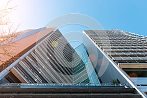 Modern office building with facade of glass on sky background