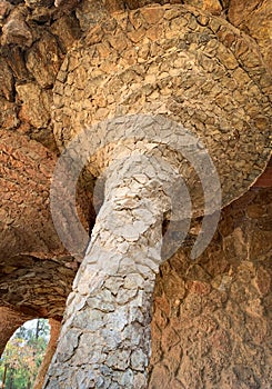 Rock walkway with stone columns in famous Park Guell, designed by Antoni Gaudi.